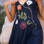 Freya Strapless Midi Dress in navy with embroidered floral design