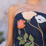 Freya Strapless Midi Dress in navy with embroidered floral design