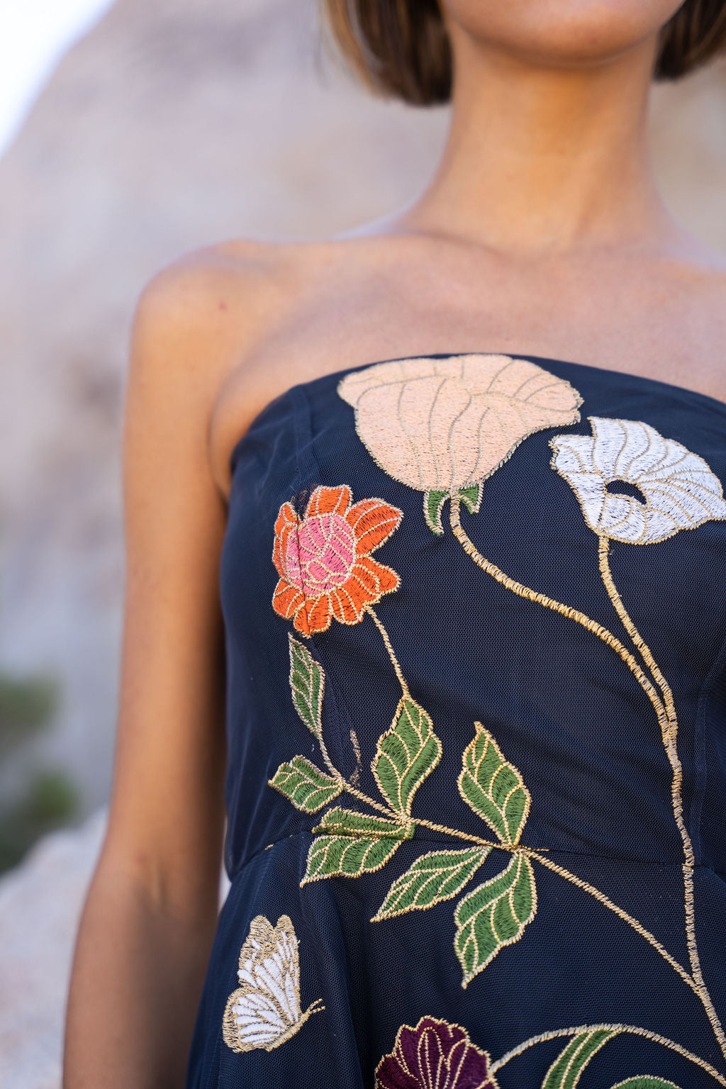Freya Strapless Midi Dress in navy with embroidered floral design