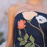 Freya Strapless Midi Dress in navy with embroidered floral design