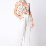 White wide leg trouser with colourful sleeveless top
