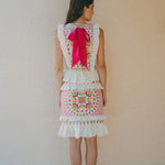 back of embroidered frill top and skirt with pink bow