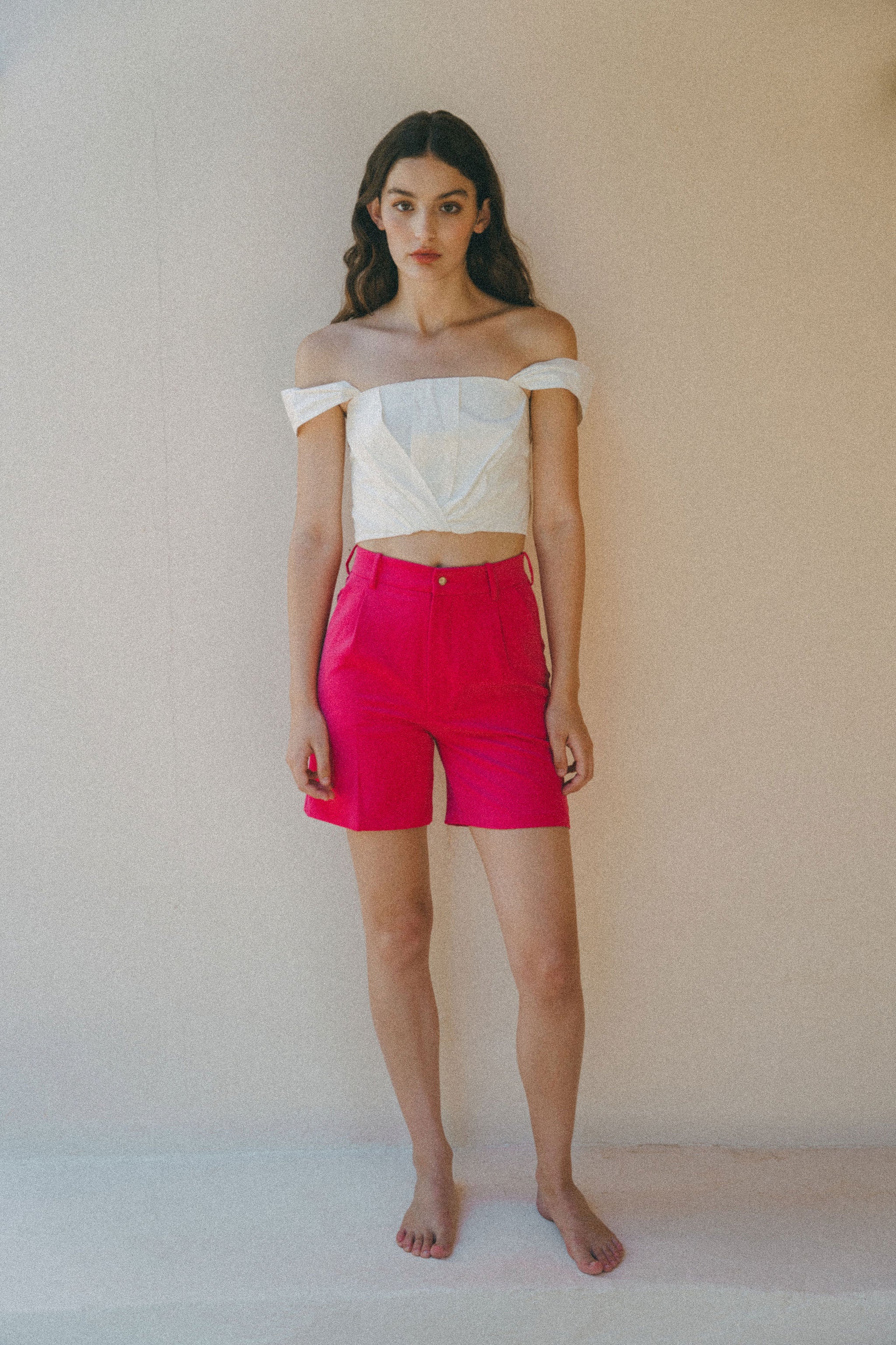 white crop top with bright pink shorts