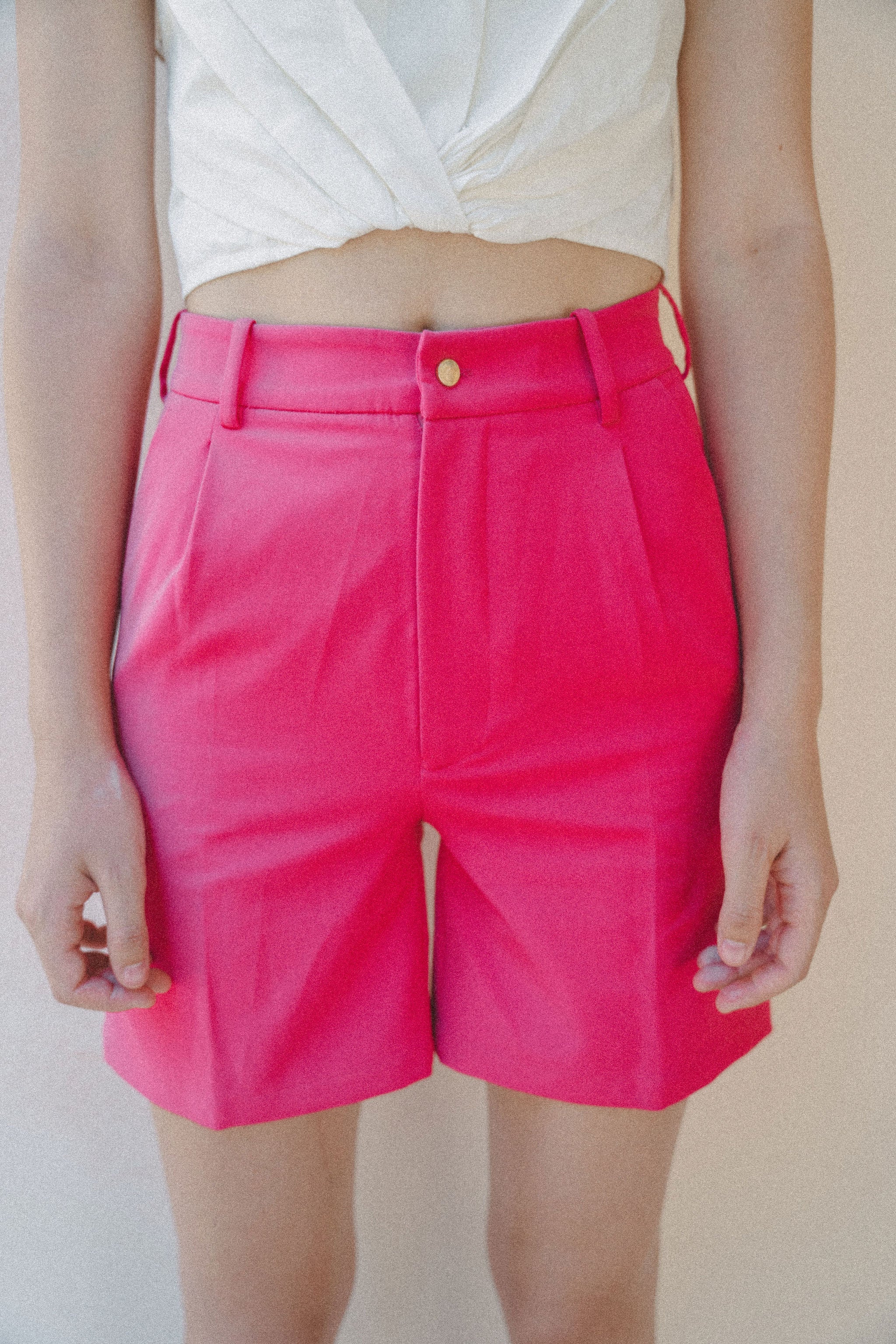 details of bright pink womenswear shorts
