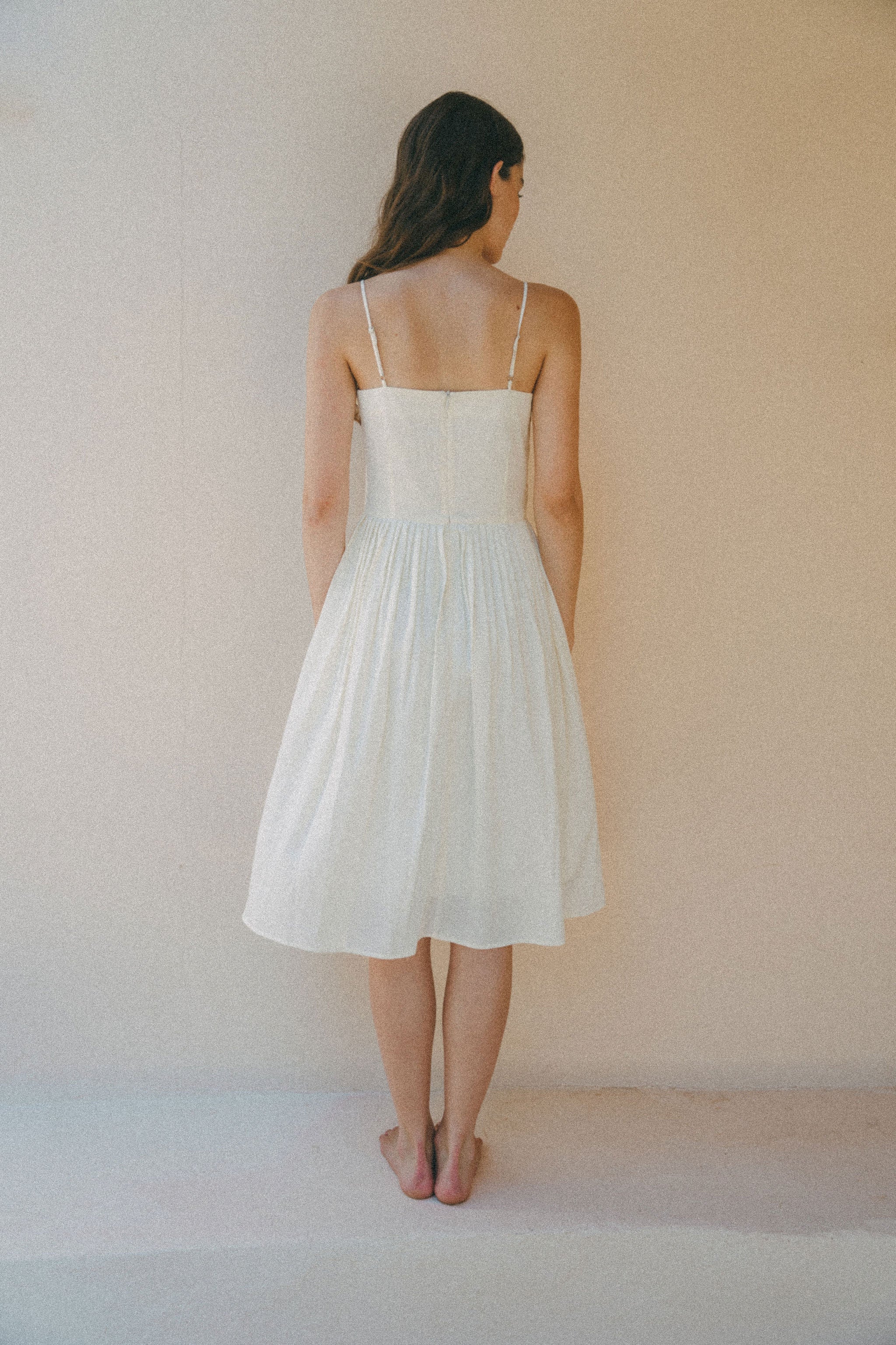 back of short white summer dress