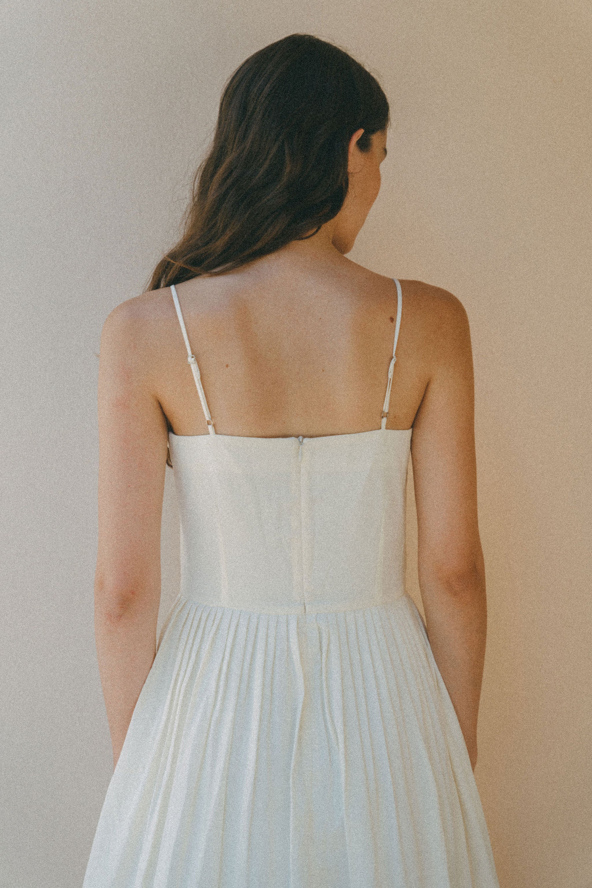 back of white summer dress with thin straps