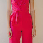 bright pink jumpsuit with pleating detail