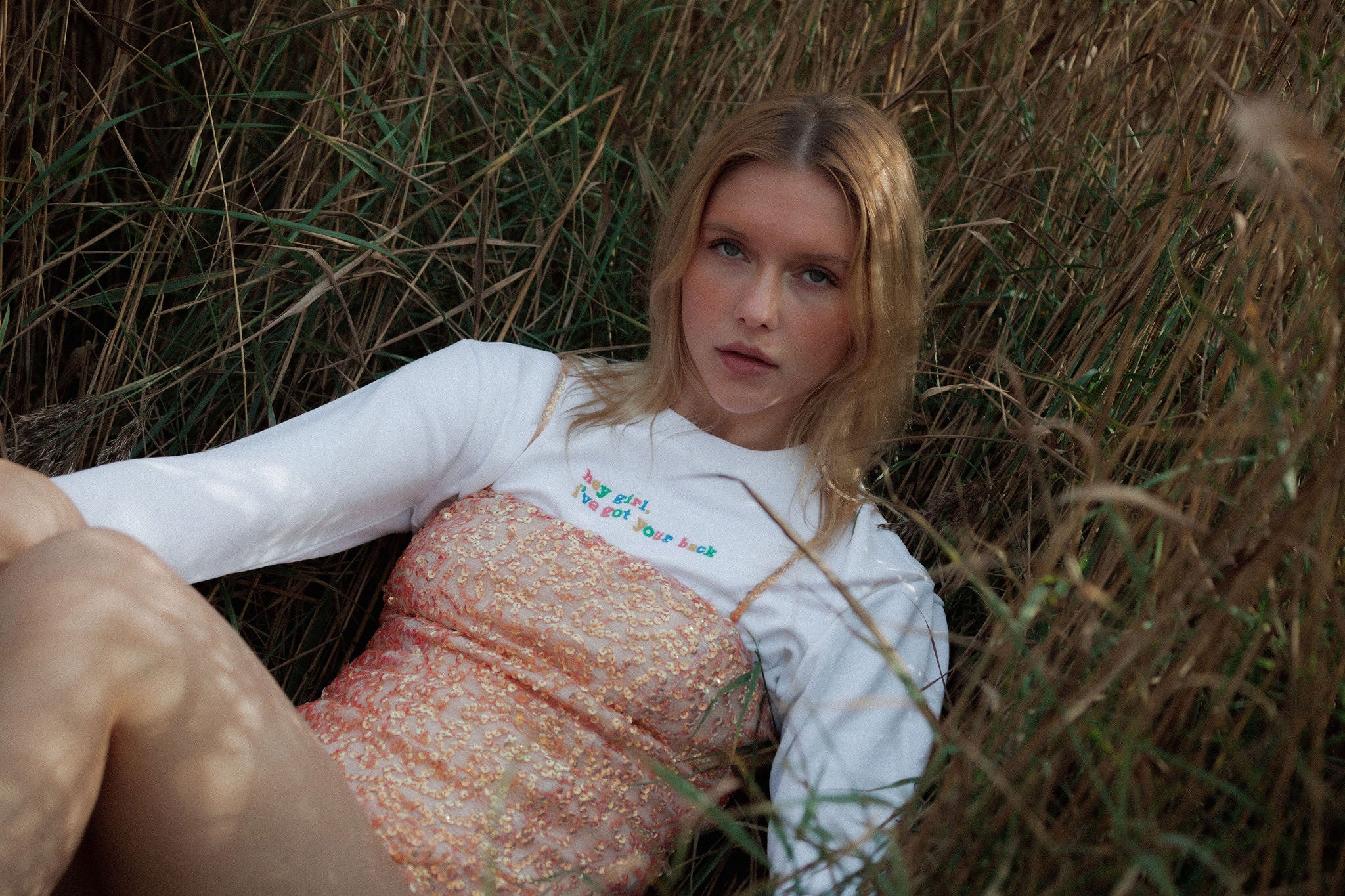 White organic cotton womens sweatshirt with the slogan "Hey girl, I've got your back" embroidered