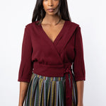 Maroon pleated wrap shirt tied with printed skirt