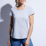 Model wears grey fitted organic cotton t-shirt with rounded hem