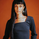 The Kōr Ribbed Knit Organic Cotton Long Sleeve Top in Black
