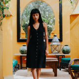 The Kōr Organic Cotton Ribbed Pinafore Dress in Black