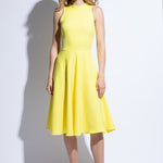 Bright yellow summer dress with flared and flowing skirt