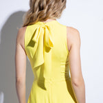 Back detailed view of yellow racer back summer dress with bow detail