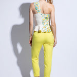 Back view of model wearing one shoulder embroidered top and bright summer tailored trouser in yellow