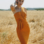 orange fitted dress with pleating details