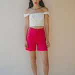 white crop top with bright pink shorts