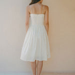 back of short white summer dress