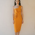 orange fitted dress with pleating details