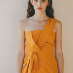 orange fitted dress with pleating details