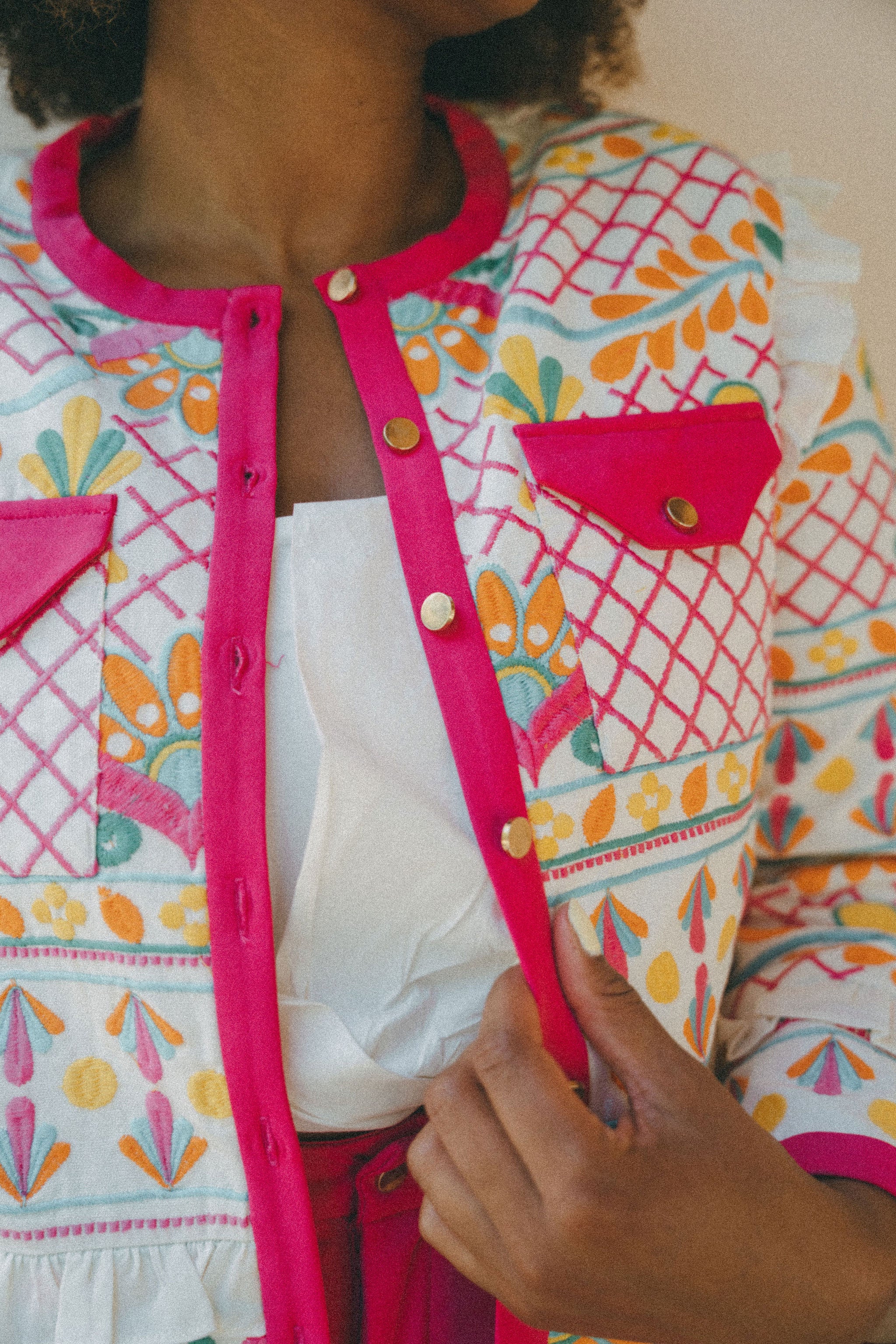 embroidered colourful jacket with pink border and pockets