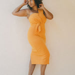 orange fitted dress with pleating details