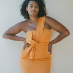 orange fitted dress with pleating details