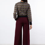 Back view of maroon wide leg trousers and tulle embroidered jumper