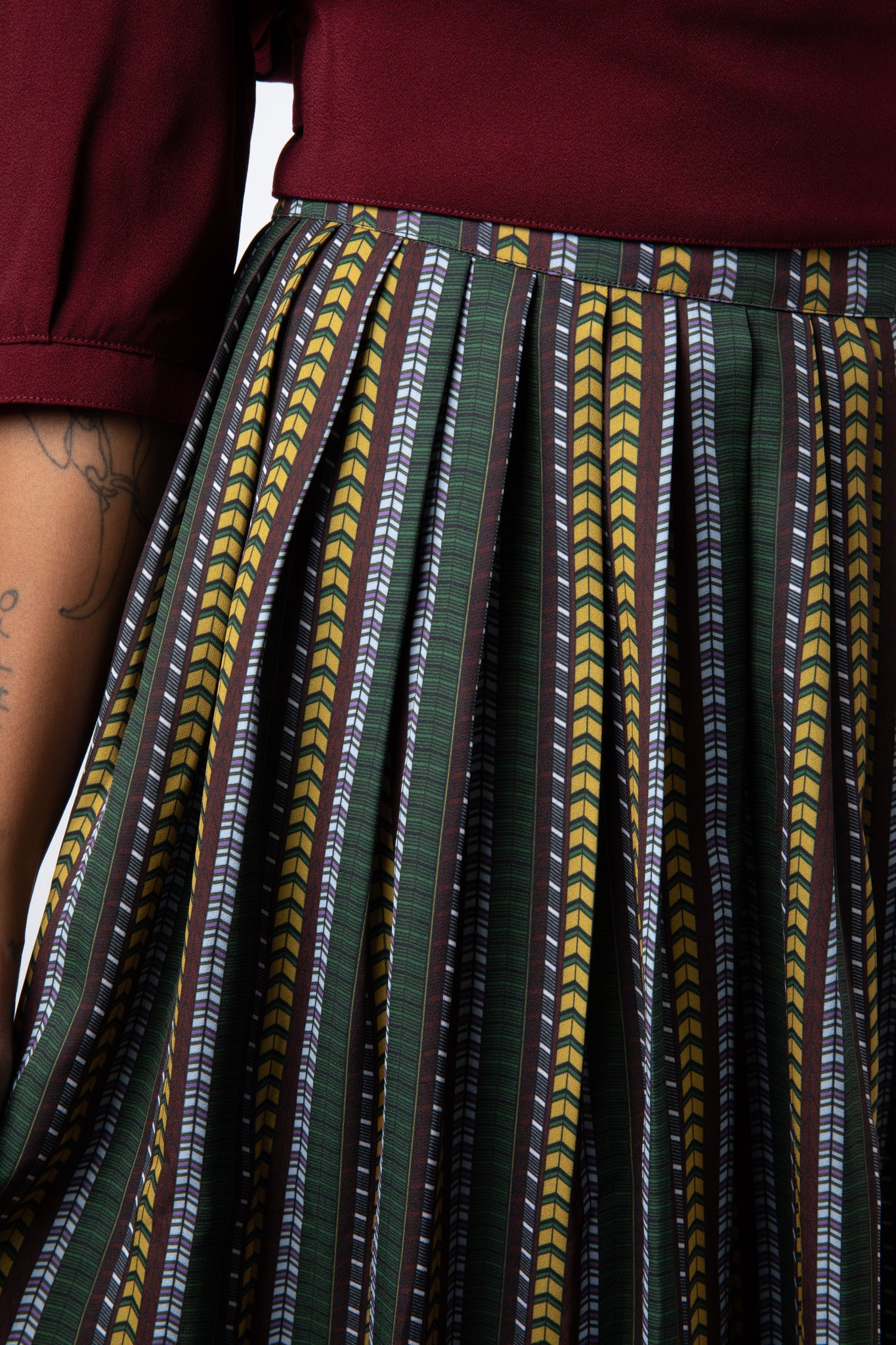 Close up of pleated and printed maxi skirt