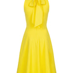 Back view of yellow summer dress with bow detail and flared skirt